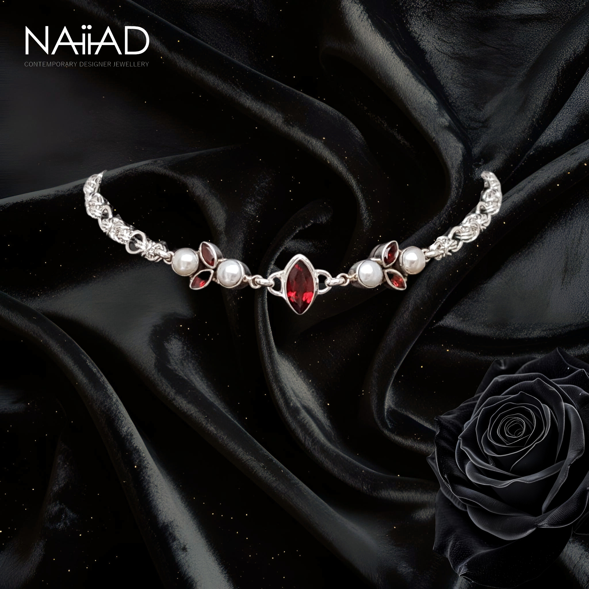 Handmade sterling silver choker necklace with garnet and freshwater pearls, on black velvet. Customisable silver jewellery for the bride and mother of the bride